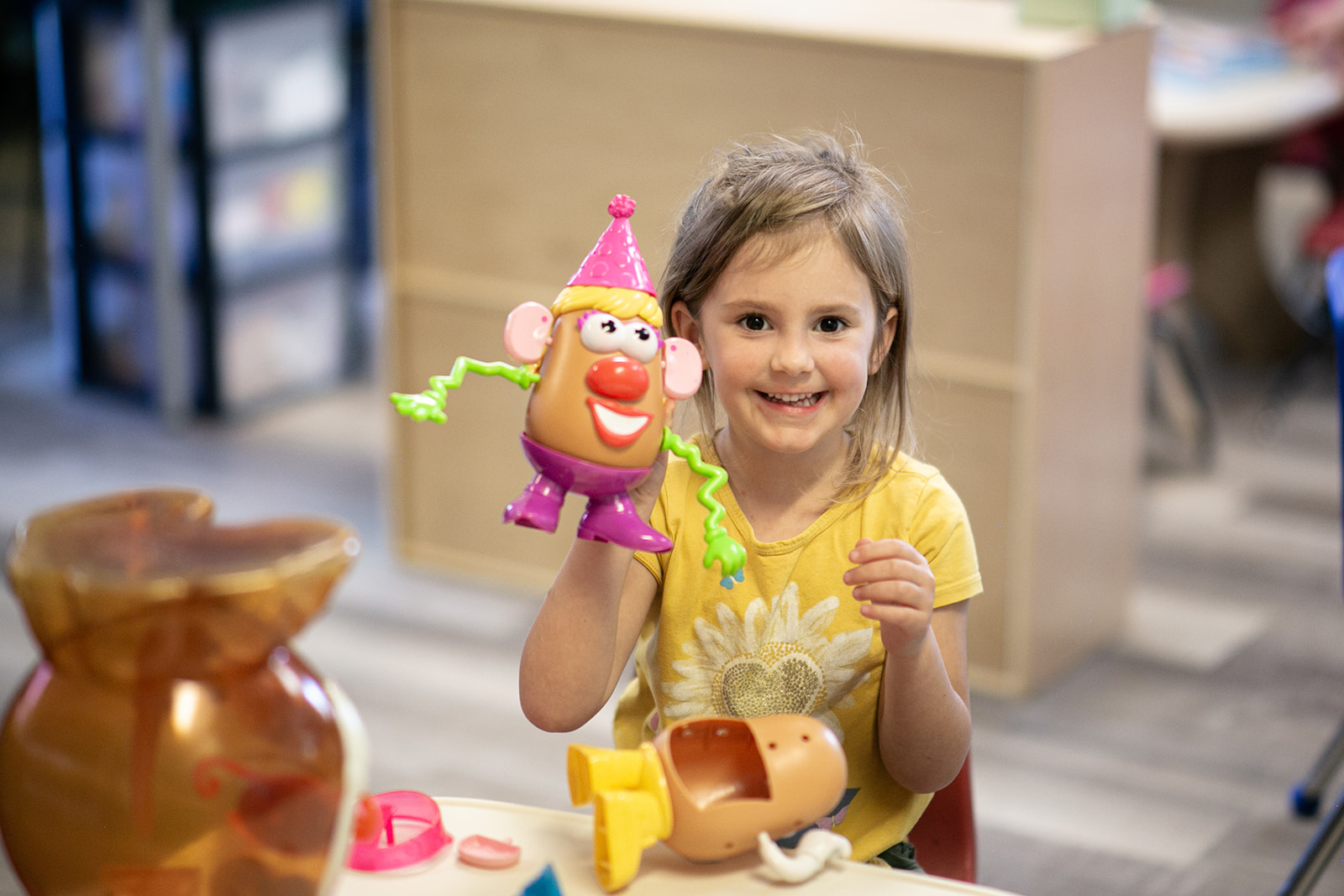 Child enjoying a creative classroom activity